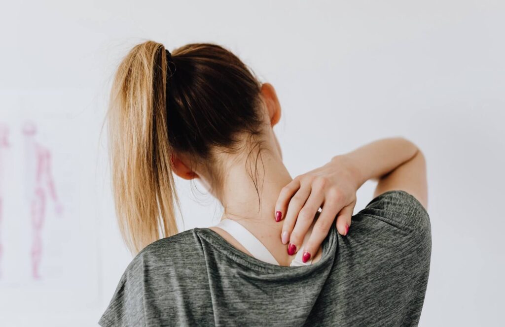 A girl feeling neck pain - real life chiropractic in salt lake city UT