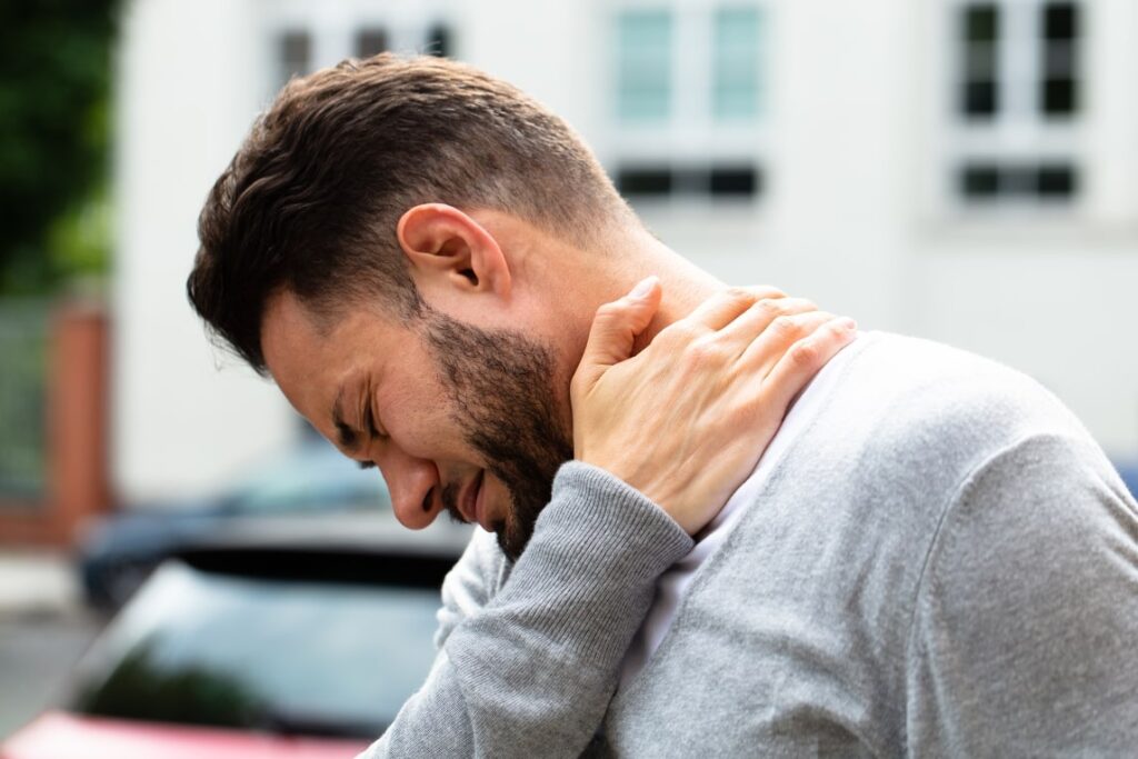 A picture showing a person feeling neck and back pain - Real Life Chiropractic in Salk Lake City UT