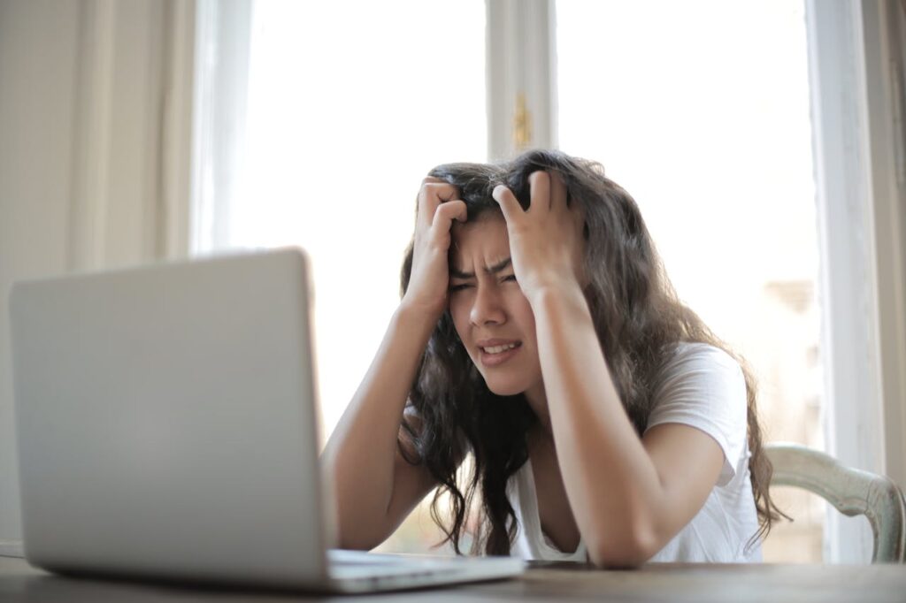A picture of a girl feeling headache - Real Life Chiropractic in Salk Lake City UT